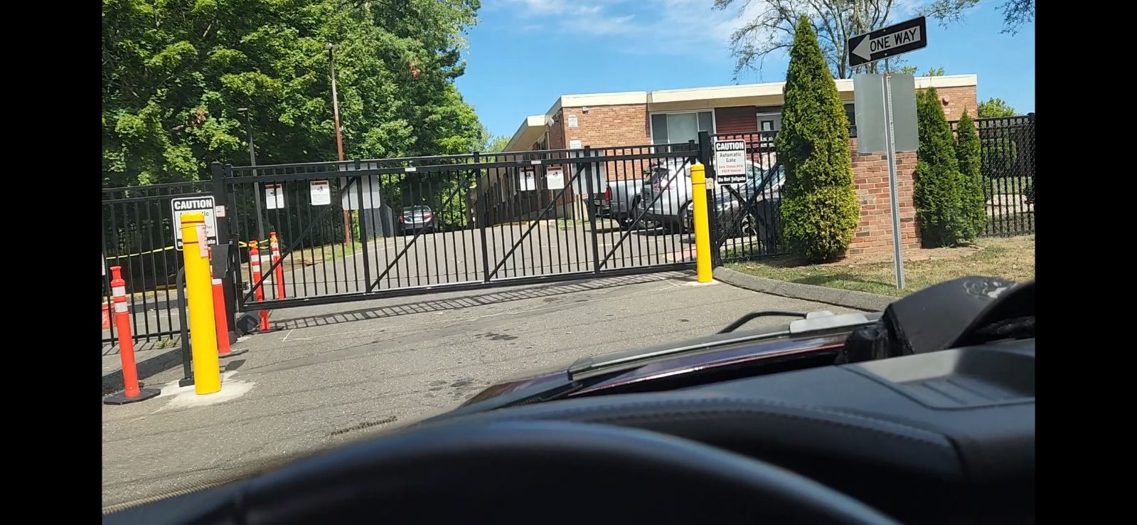 black commercial gate with automatic opener