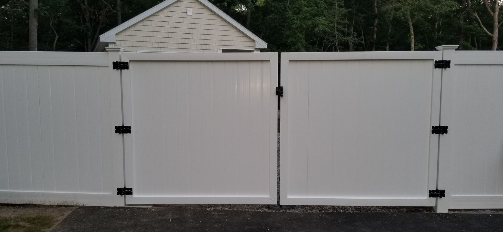 white vinyl fence with a gate